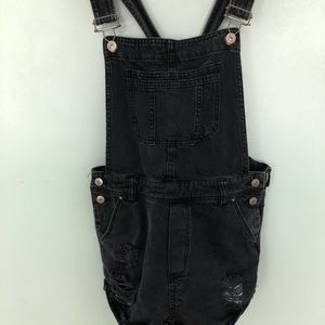 Black ripped, shorts, overalls.
